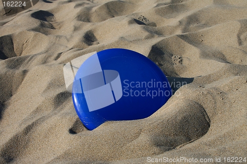 Image of Frisbee in sand