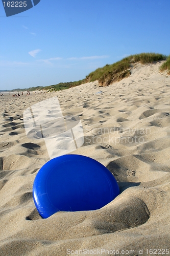 Image of Frisbee in sand