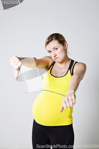 Image of Pregnant woman thumbs down