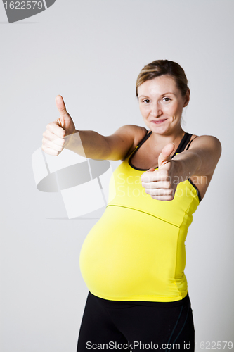Image of Pregnant woman doing thumbs up