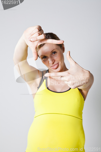 Image of Pregnant woman making a frame