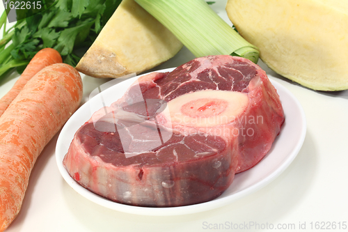 Image of leg slice with soup vegetables