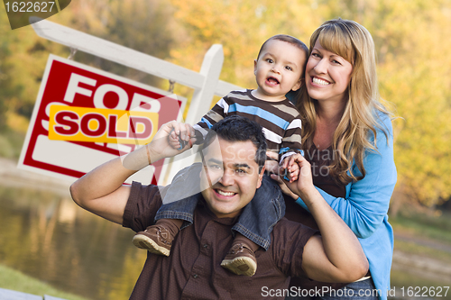 Image of Mixed Race Couple, Baby, Sold Real Estate Sign