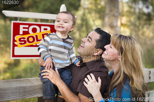 Image of Mixed Race Couple, Baby, Sold Real Estate Sign