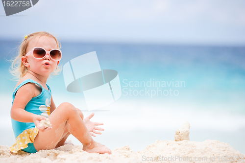 Image of Little girl at tropical beach