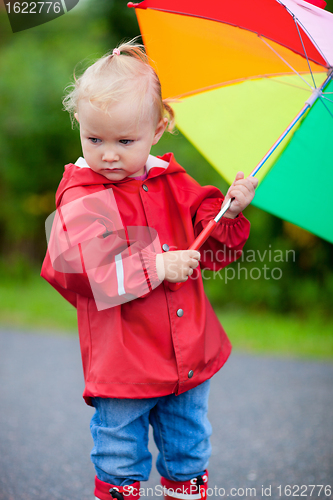Image of Portrait of toddler girl with umbrella