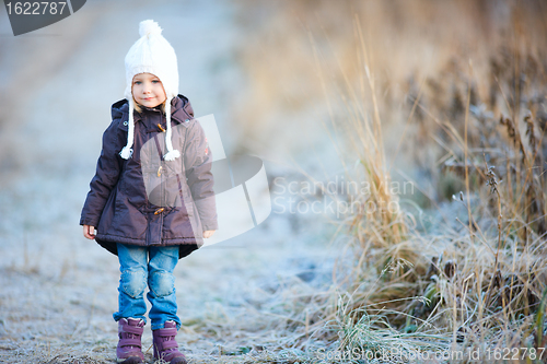 Image of Little girl outdoors on winter day