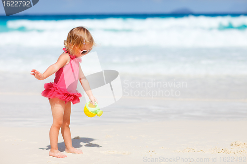 Image of Little girl playing at beach