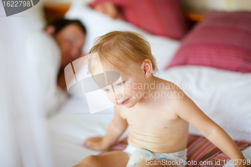 Image of Father and daughter in bedroom