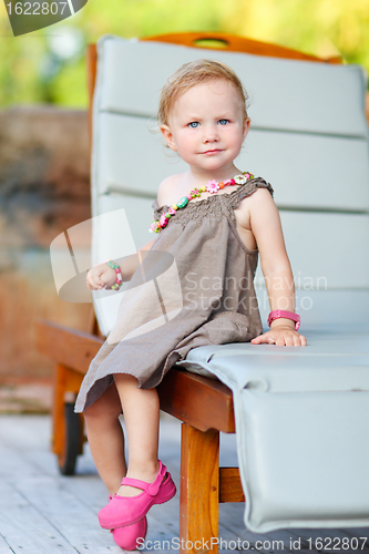 Image of Vertical full body portrait of adorable toddler girl