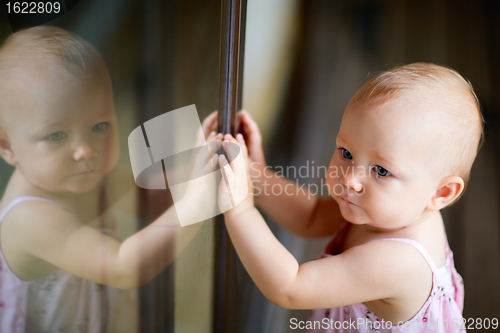 Image of Outdoor casual portrait of baby girl