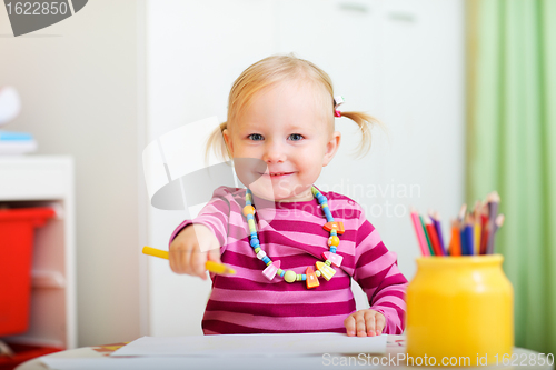 Image of Playful little girl drawing 