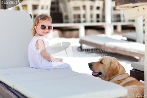 Image of Little girl and dog