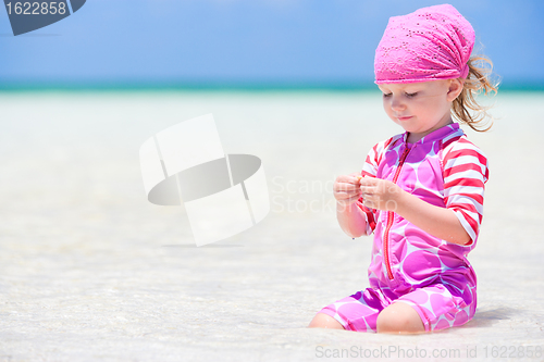 Image of Little girl at tropical beach