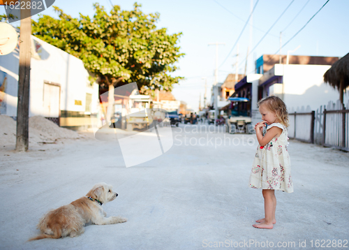 Image of Girl and dog at town