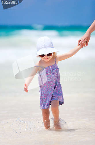 Image of Little cute girl at beach