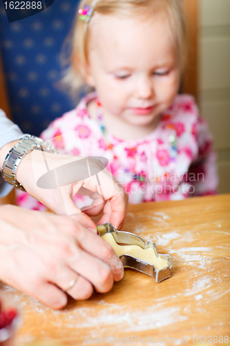 Image of Closeup of family baking cookies