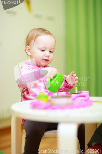 Image of Little girl playing with toys