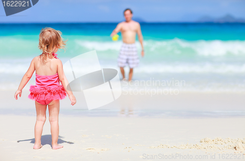 Image of Little girl and her father on tropical beach