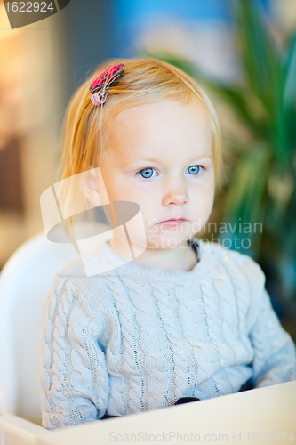 Image of Toddler girl sitting at table