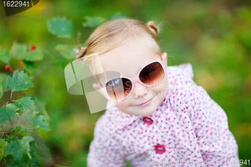 Image of Cute girl in autumn park