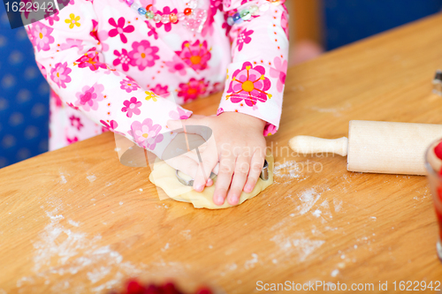 Image of Closeup of toddler girl baking
