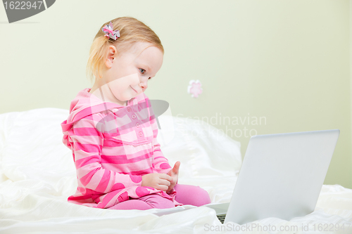 Image of Little girl with laptop