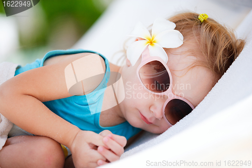 Image of Little girl resting at beach