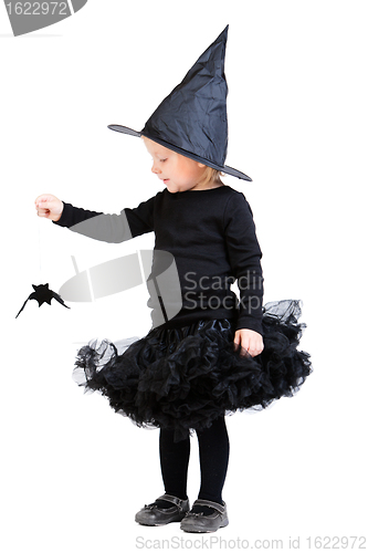 Image of Little witch holding small bat