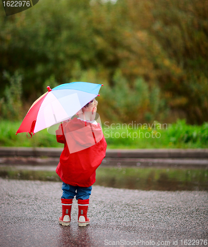 Image of Toddler girl with umbrella