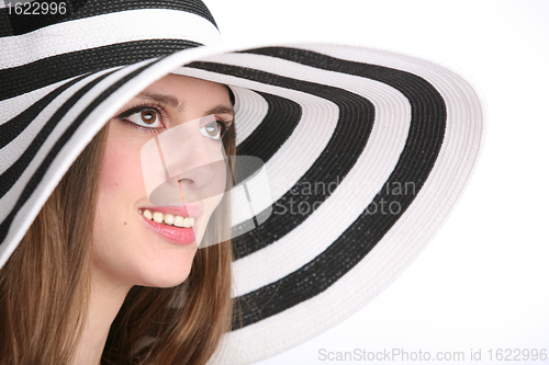 Image of beautiful smiling girl in striped hat