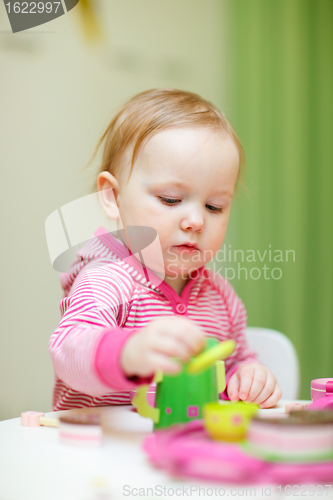 Image of Toddler girl playing with toys