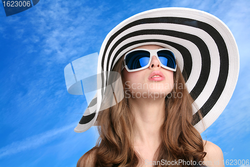 Image of beautiful girl in striped hat