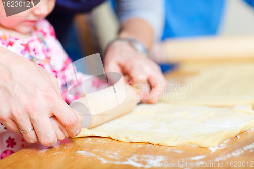 Image of Closeup of family baking pie