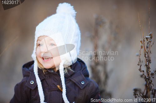 Image of Little girl outdoors on winter day