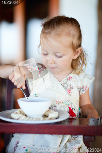 Image of Girl eating breakfast