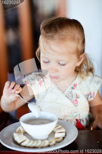 Image of Girl eating breakfast