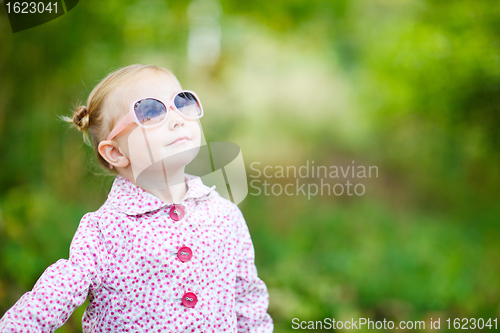 Image of Cute girl in autumn park