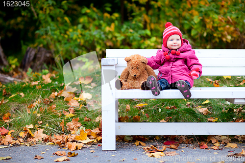 Image of Toddler girl outdoors on autumn day