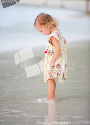 Image of Little girl on tropical beach