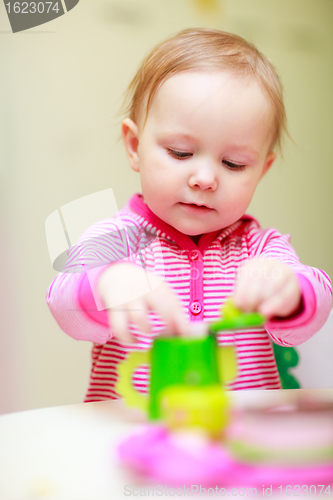 Image of Little girl playing with toys