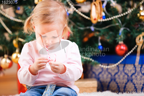 Image of Toddler girl with Christmas candy