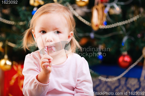 Image of Toddler girl with Christmas candy