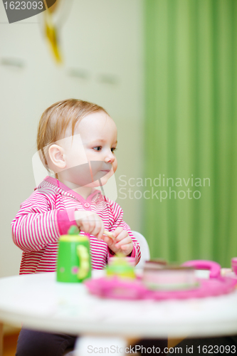 Image of Toddler girl playing at home