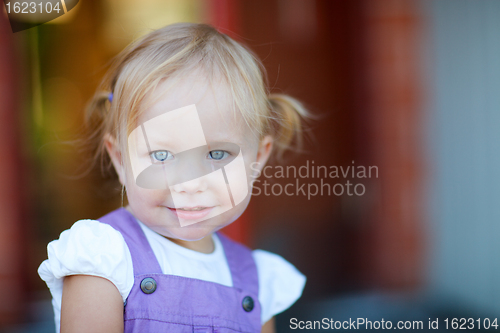 Image of Portrait of adorable playful girl