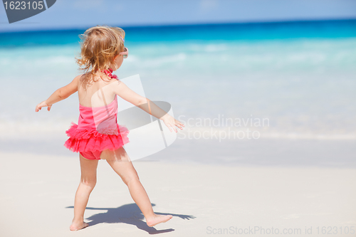 Image of Little girl on tropical beach