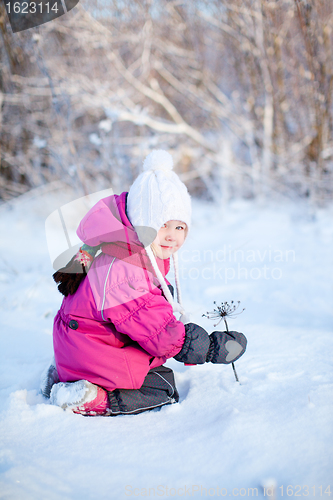 Image of Little girl outdoors on winter day