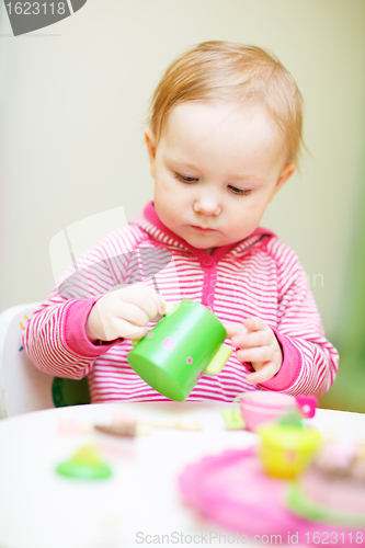 Image of Toddler girl playing with toys
