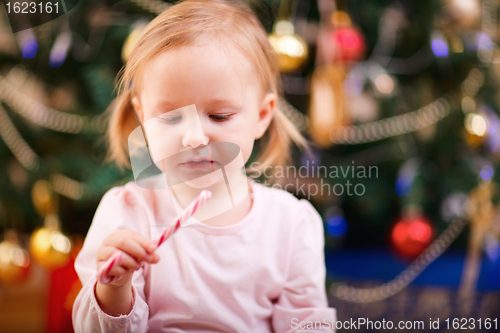 Image of Toddler girl with Christmas candy