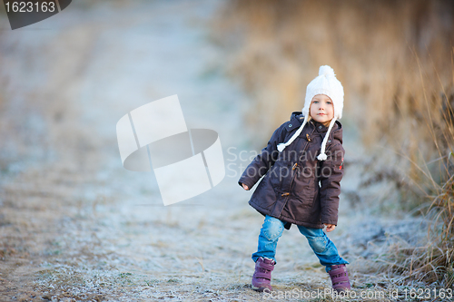 Image of Little girl outdoors on winter day